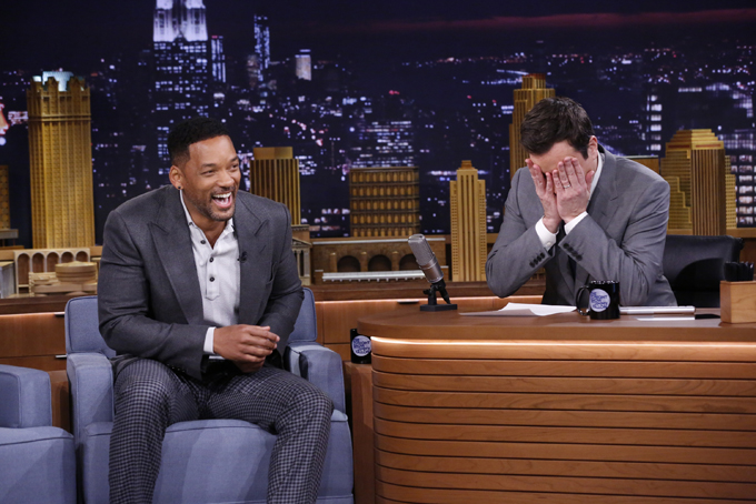  In this photo provided by NBC, Jimmy Fallon appears with Will Smith, left, during his "The Tonight Show" debut on Monday, Feb. 17, 2014, in New York. (AP Photo/NBC, Lloyd Bishop)