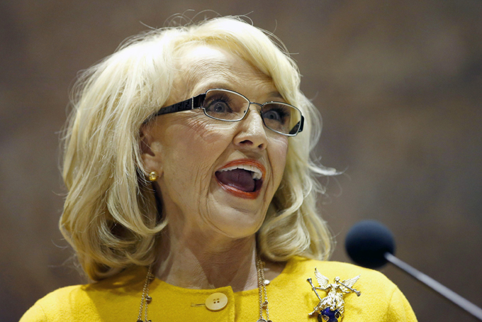 FILE - In this Jan. 13, 2014 file photo, Arizona Gov. Jan Brewer speaks during her State of the State address at the Arizona Capitol in Phoenix. The Republican governor faced intensifying pressure Tuesday from CEOs, politicians in Washington and state lawmakers in her own party to veto a bill that would allow business owners with strongly held religious beliefs to deny service to gays and lesbians. (AP Photo/Ross D. Franklin, File)