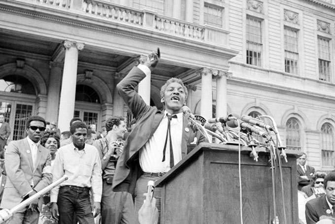 BROTHER OUTSIDER—Legendary Gay Civil Rights Activist Bayard Rustin speaks from a platform in front of New York’s City Hall at a rally in favor of integrating schools on May 18, 1964. (AP Photo/File)