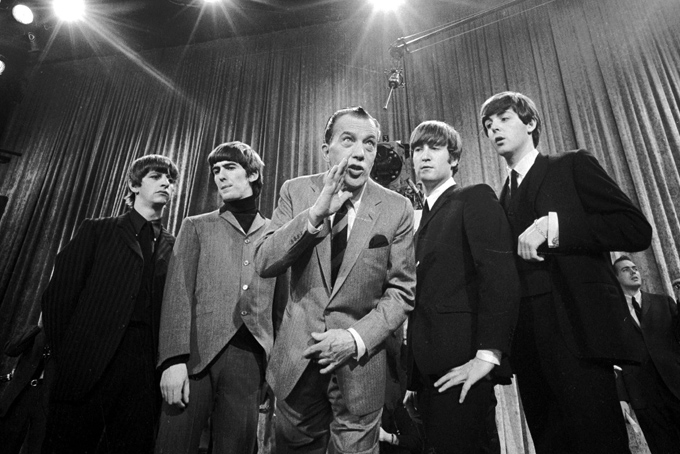 In this Feb. 9, 1964 file photo, Ed Sullivan, center, stands with The Beatles, from left, Ringo Starr, George Harrison, John Lennon, and Paul McCartney, during a rehearsal for the British group's first American appearance, on the "Ed Sullivan Show," in New York. CBS is planning a two-hour special on Feb. 9, 2014, to mark the 50th anniversary of the Beatles' first appearance in America on "The Ed Sullivan Show." (AP Photo, File)