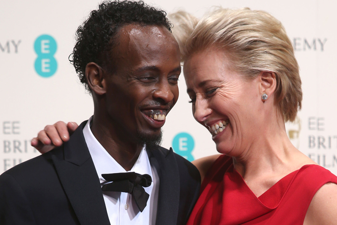 Barkhad Abdi, winner of best supporting actor and Emma Thompson pose for photographers in the winners room at the EE British Academy Film Awards held at the Royal Opera House on Sunday Feb. 16, 2014, in London. (Photo by Joel Ryan/Invision/AP)