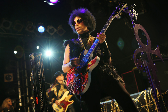 This photo taken on Tuesday Feb. 5, 2014 and released by 3RDEYEGIRL NPG Records on Wednesday Feb. 5, 2014, shows Prince performing in London. (AP Photo/3RDEYEGIRL NPG Records)