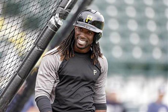 In this March 17, 2013 file photo, Pittsburgh Pirates center fielder Andrew McCutchen smiles after batting practice before an exhibition spring training baseball game against the New York Yankees in Bradenton, Fla. McCutchen arrived at Pirates spring training early. The defending National League MVP is only too anxious to get on with an encore. (AP Photo/Carlos Osorio, File) 