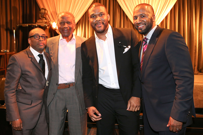 This Feb. 26, 2014 photo released by shows, from left, Spike Lee, Sidney Poitier, Tyler Perry and Malcolm Lee at a ceremony by Essence magazine honoring the achievements of African-American men in Hollywood, in Beverly Hills, Calif. (AP Photo/Essence-Tyler Perry, George Burns)