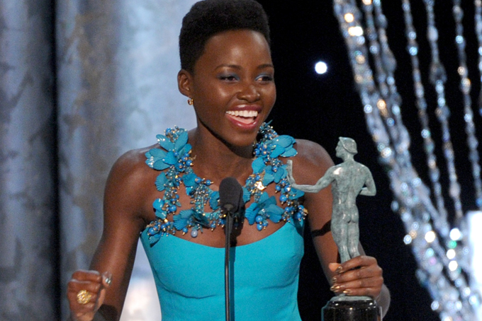 In this Jan. 18, 2014 file photo, Lupita Nyong'o accepts the award for outstanding performance by a female actor in a supporting role for "12 Years a Slave," at the 20th annual Screen Actors Guild Awards at the Shrine Auditorium, in Los Angeles. (Photo by Frank Micelotta/Invision/AP, file)