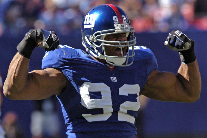 In this Oct. 8, 2006, file photo, New York Giants defensive end Michael Strahan reacts after sacking Washington Redskins quarterback Mark Brunell during second quarter NFL football at Giants Stadium in East Rutherford, N.J. Strahan was elected to the Pro Football Hall of Fame on Saturday, Feb. 1, 2014. (AP Photo/Bill Kostroun)