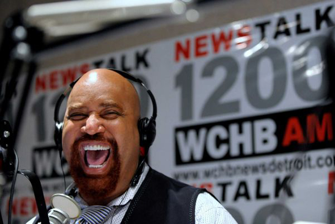 In this Oct. 16, 2013 photo, radio host Angelo Henderson laughs with Detroit Mayoral Candidate Mike Duggan and his guest Impact Church Pastor Keenan Knox on Henderson's show called, “Your Voice.” (Photo: Todd McInturf, AP / Detroit News)