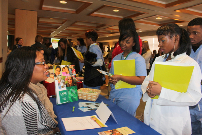 ALL ABOUT HEALTH-- Breonna Thorne, left, of Perry High School, and Chevyionne Akeen, of Westinghouse High School, network and speak with health care professionals at the UPMC Center for Engagement and Inclusion’s Next Steps Bridges to Health Care Careers Program summit on Jan. 31. (Photo by J.L. Martello)