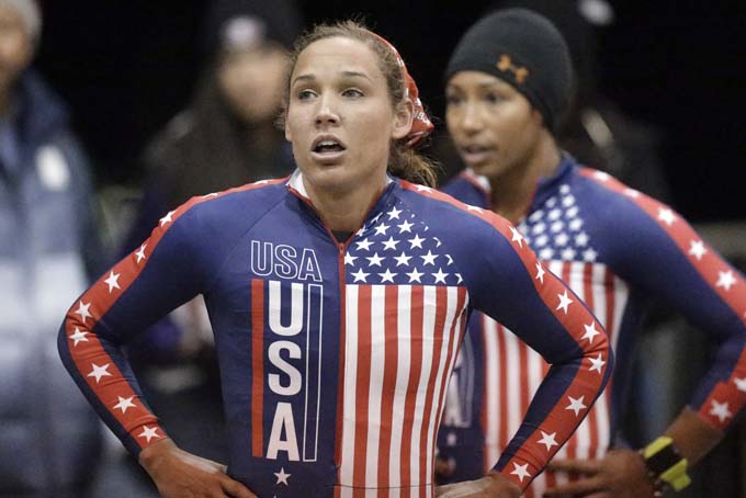 In this Oct. 25, 2013, photo, Jazmine Fenlator, right, and Lolo Jones look up after coming to a stop after racing in the U.S. women's bobsled team Olympic trials in Park City, Utah.  (AP Photo/Rick Bowmer, File)