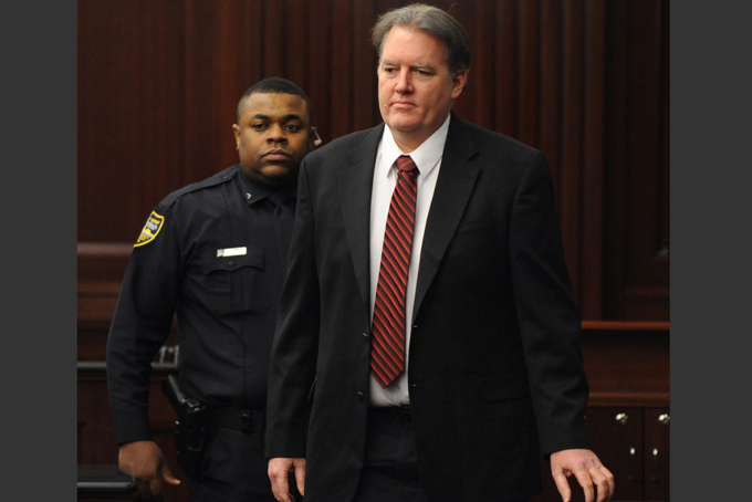 Defendant Michael Dunn is brought into the courtroom just before 5 p.m., where Judge Russell Healey announced that the jury was deadlocked on charge one and have verdicts on the other four charges as they deliberate in the trial of Dunn, Saturday, Feb. 15, 2014, for the shooting death of Jordan Davis in November 2012. Dunn is charged with fatally shooting 17-year-old Davis after an argument over loud music outside a Jacksonville convenient store. (AP Photo/The Florida Times-Union, Bob Mack, Pool)