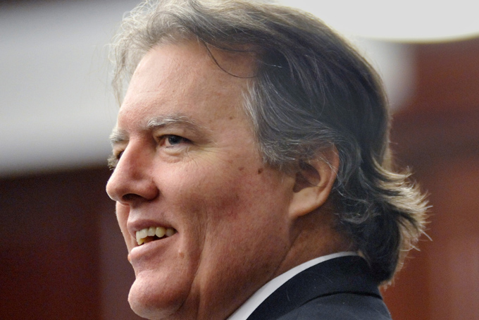 In this March 19, 2013 file photo, Michael David Dunn smiles at family and friends who came to testify at his bond hearing in Jacksonville, Fla. (AP Photo/The Florida Times-Union, Will Dickey, File)