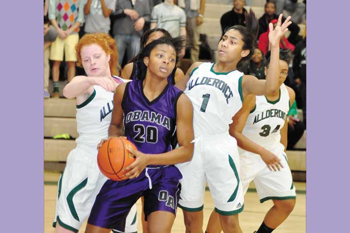 MICHAELA PORTER (20) of Obama Academy pulls in a rebound in front of Allderdice's Erin Yapsuga (Left) and Lexxus Charles (1) in the City League Championship game.