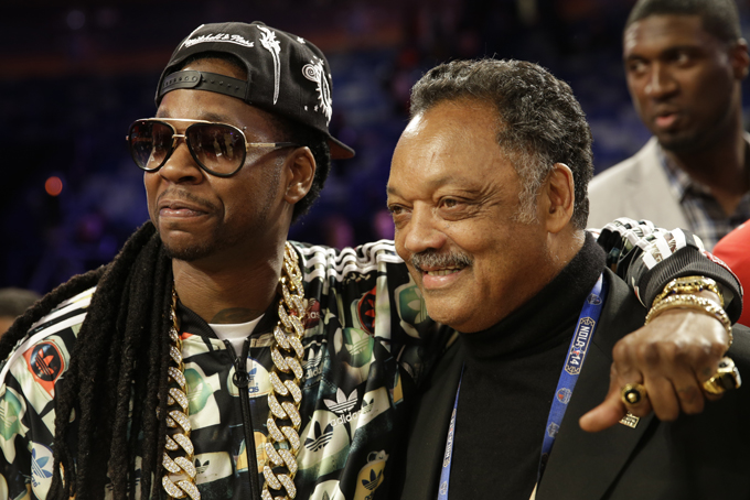 Singer 2 Chainz, left, poses for a photo with the Rev. Jesse Jackson Sr. after the skills competition at the NBA All Star basketball game, Saturday, Feb. 15, 2014, in New Orleans. (AP Photo/Gerald Herbert)