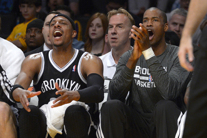 Brooklyn Nets forward Paul Pierce, left, and center Jason Collins cheer from the bench after the team scored during the first half of an NBA basketball against the Los Angeles Lakers, Sunday, Feb. 23, 2014, in Los Angeles. (AP Photo/Mark J. Terrill)