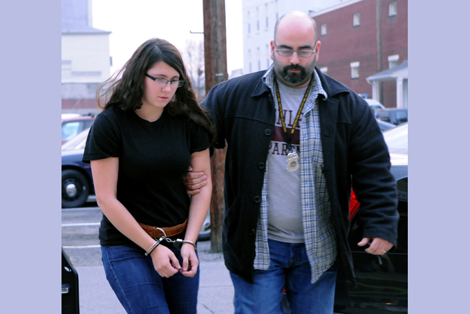 In this Tuesday, Dec. 3, 2013 file photo, Miranda K. Barbour is led into District Judge Ben Apfelbaum's office in Sunbury, Pa., by Sunbury policeman Travis Bremigen. (AP Photo/The News-Item, Mike Staugaitis, File) 