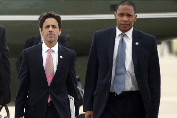 In this Oct. 30, 2013, photo, David Simas, Deputy Senior Adviser for Communications and Strategy, left, and Rob Nabors, Deputy Chief of Staff accompany President Barack Obama to board Air Force One at Andrews Air Force Base, Md., as he travels to Boston. (AP Photo/Charles Dharapak, File)