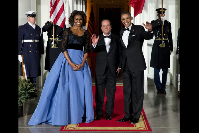 First lady Michelle Obama, left, and President Barack Obama welcome French President François Hollande for a State Dinner at the North Portico of the White House on Tuesday, Feb. 11, 2014, in Washington. (AP Photo/ Evan Vucci)