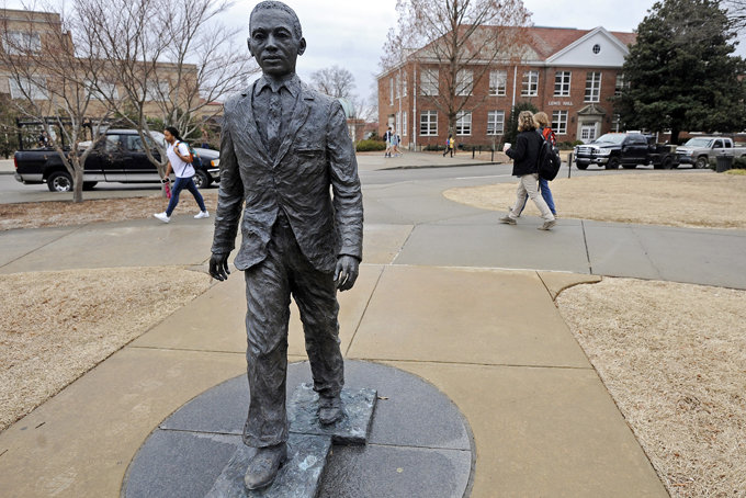  The James Meredith statue is seen on the University of Mississippi campus in Oxford, Miss., Monday, Feb. 17, 2014. A $25,000 reward is available for information leading to the arrest of two men involved in sullying the statue early Sunday, Feb. 16. (AP Photo/The Daily Mississippian, Thomas Graning)