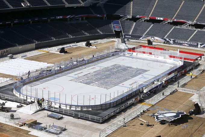 Work continues to transform Soldier Field for Saturday's Stadium Series NHL hockey game between the Chicago Blackhawks and the Pittsburgh Penguins, Thursday, Feb. 27, 2014, in Chicago. . (AP Photo/Charles Rex Arbogast)