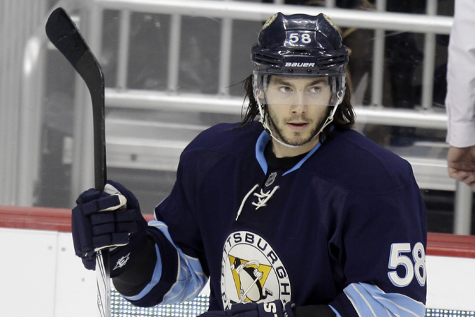 This is a Feb. 11, 2012, file photo showing Pittsburgh Penguins' Kris Letang (58) during an NHL hockey game against the Winnipeg Jets in Pittsburgh. Letang will be out for six-plus weeks after having a stroke. Penguins general manager Ray Shero announced Friday, Feb. 7, 2014, that Letang had a stroke last week. (AP Photo/Gene J. Puskar, File)