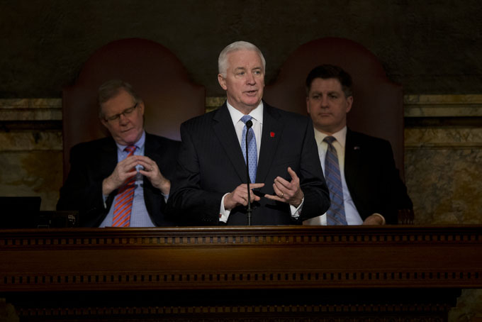 Gov. Tom Corbett delivers his budget address for the 2014-15 fiscal year to a joint session of the Pennsylvania House and Senate on Tuesday, Feb. 4, 2014, in Harrisburg, Pa. Speaker of the Pennsylvania House of Representatives, Rep. Sam Smith, R-Jefferson, is at left, and Pennsylvania Lt. Gov. Jim Cawley is at right. (AP Photo/Matt Rourke)