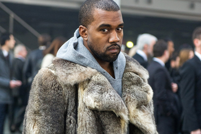 This Jan. 17, 2014 file photo shows singer Kanye West as he arrives for the Givenchy men's Fall-Winter 2014-2015 fashion collection in Paris. (AP Photo/Zacharie Scheurer, File)