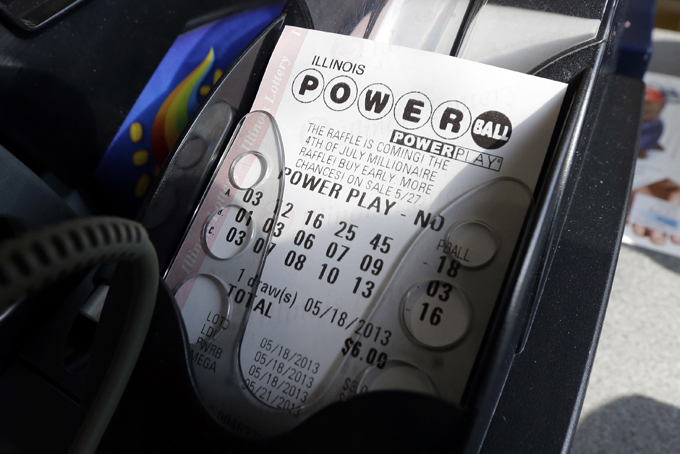 A Powerball lottery ticket is printed out of a lottery machine at a convenience store in Chicago on in this May 18, 2013 file photo. A (AP Photo/Nam Y. Huh, FILE)