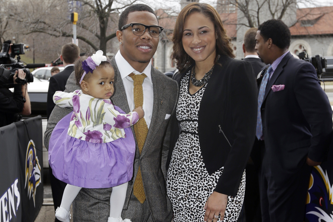 In this March 11, 2013 file photo, Baltimore Ravens running back Ray Rice, left, poses with his daughter, Rayven, and Janay Palmer as they arrive for a screening of a new film released on DVD that chronicles the team's championship NFL football season in Baltimore. (AP Photo/Patrick Semansky, File)