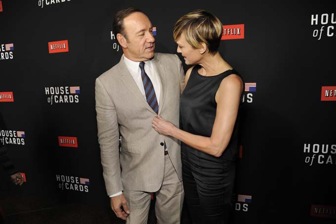 Kevin Spacey, left, and Robin Wright arrive at a special screening for season 2 of "House of Cards", on Thursday, Feb. 13, 2014 in Los Angeles. (Photo by Chris Pizzello/Invision/AP)