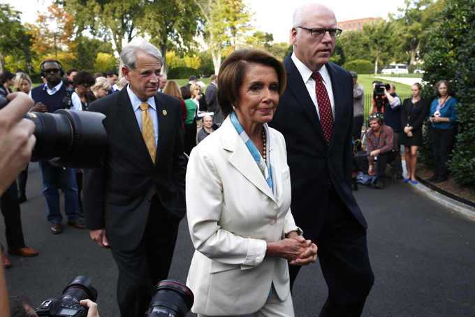 In this Oct. 15, 2013, file photo, House Minority Leader Nancy Pelosi of Calif., center, walks away after answering questions from reporters with Rep. Steve Israel, D-N.Y., and Rep. Joseph Crowley, D-N.Y., right, after their meeting with President Barack Obama regarding the partial government shutdown and looming debt default outside the West Wing at the White House in Washington. When Obama delivers his State of the Union address on Jan. 28, 2014, he isn’t just setting out his own agenda. He’s also delivering an opening salvo in the yearlong fight for control of Congress. Although not explicitly political, the speech will frame an economic argument that Democrats hope will appeal to voters across the country. "Middle-class security is the defining issue of our time," said Israel, who chairs the House Democrats’ campaign arm. (AP Photo/Charles Dharapak, File)