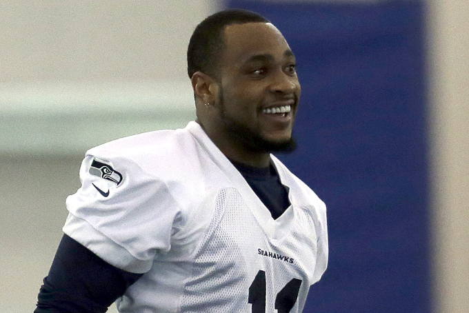 Seattle Seahawks wide receiver Percy Harvin smiles as he warms up at the start of NFL football practice Wednesday, Jan. 29, 2014, in East Rutherford, N.J. The Seahawks and the Denver Broncos are scheduled to play in the Super Bowl XLVIII football game Sunday, Feb. 2, 2014. (AP Photo/Jeff Roberson)