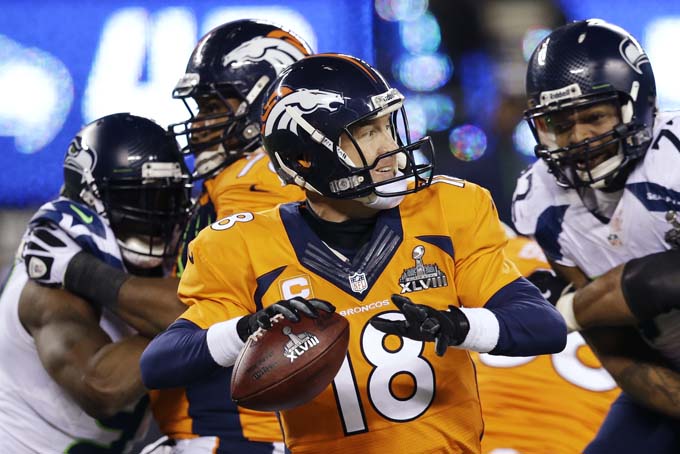  Denver Broncos' Peyton Manning looks to pass against the Seattle Seahawks during the second half of the NFL Super Bowl XLVIII football game Sunday, Feb. 2, 2014, in East Rutherford, N.J. (AP Photo/Julio Cortez) 