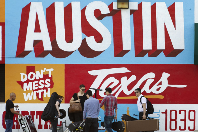 In this March 14, 2013 file photo, a band is on the move on the corner of Sixth Street and I-35 at South by Southwest in Austin, Texas. (AP Photo/Austin American-Statesman, Jay Janner) 