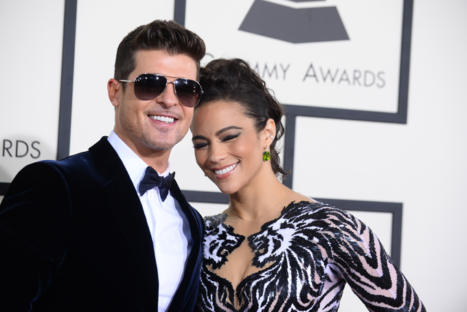 Robin Thicke, left, and Paula Patton arrive at the 56th annual Grammy Awards at Staples Center on Sunday, Jan. 26, 2014, in Los Angeles. (Photo by Jordan Strauss/Invision/AP)