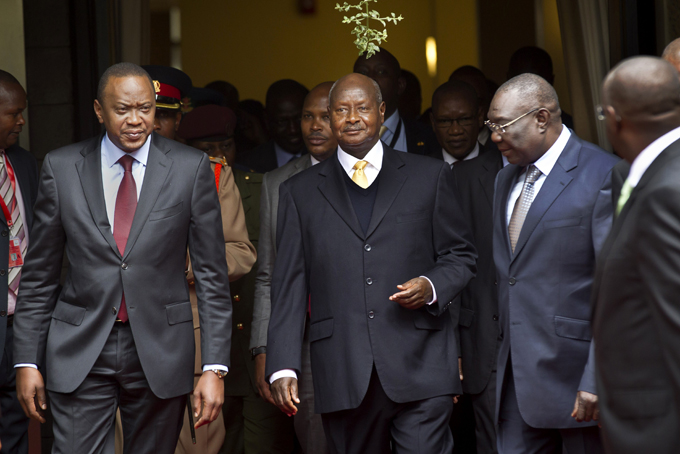 In this July 31, 2013, file photo, Kenya's President Uhuru Kenyatta, left, Uganda's President Yoweri Museveni, center, and the transitional leader of the Central African Republic Michel Djotodia, right, arrive for the Special Summit of the International Conference on the Great Lakes Region (ICGLR) held at the United Nations Office in Nairobi, Kenya. (AP Photo/Ben Curtis, File)
