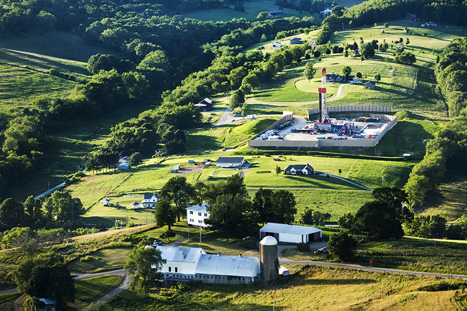 A gas drilling rig in the middle of a Pleasant Township Pennsylvania neighborhood.  The pollution from these drill rigs is a major concern to everyone in the area.  The noise pollution from truck traffice and the drilling site is also a problem