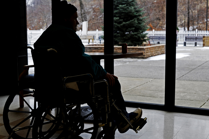 A resident sits in one of the common areas of Kane Regional Center in Glen Hazel. (Photo by Connor Mulvaney)