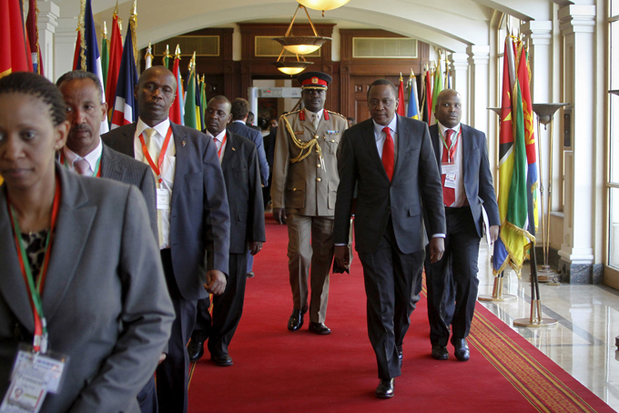 Kenya's President Uhuru Kenyatta, center foreground, arrives for the Intergovernmental Authority on Development (IGAD) summit, held on the eve of the heads of state meeting of the African Union summit, in Addis Ababa, Ethiopia, Thursday, Jan. 29, 2015. The threat posed by Boko Haram, Nigeria's Islamic extremist rebels, will be a focus of U.N. Secretary-General Ban Ki-moon as he attends the African Union heads of state summit in Addis Ababa, Ethiopia, a spokesman said. (AP Photo/Elias Asmare)