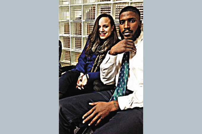 GERALD BROOKS WITH GRINDWARE SECRETARY TONIYA K. DURANTE.