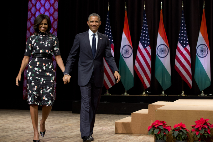 U.S. President Barack Obama walks from the stage with first lady Michelle Obama after speaking at the Siri Fort Auditorium in New Delhi, India, Tuesday, Jan. 27, 2015. (AP Photo/Carolyn Kaster)