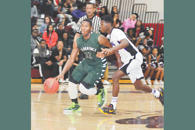 RAMON CREIGHTON Allderdice drives against Denzil Fields of Obama Academy. Creighton chipped in with 14 points in the Dragons 66-53 win.  