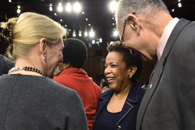 Sen. Charles Schumer, D-N.Y., right, and Sen. Kirsten Gillibrand, D-N.Y., left, talk with Attorney General nominee Loretta Lynch on Capitol Hill in Washington, Wednesday, Jan. 28, 2015, before the Senate Judiciary Committee’s hearing on Lynch's nomination. (AP Photo/Susan Walsh)