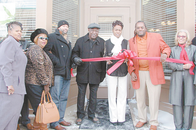 SUPPORTERS ARE READY FOR SERVICE—Donna Richards, Ruth Byrd-Smith, R. Daniel Lavelle, Roger Humphries, Me’chele Humphries-Hayes, Allen Hayes and Cynthia Webb cut the ribbon for the opening of Me’chele’s Wellness Spa in the Strip District. (Photos by Diane I. Daniels) 