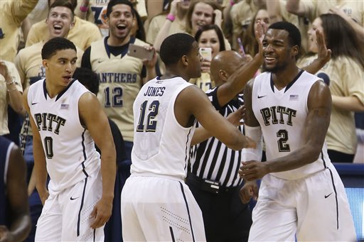 Michael Young (2), James Robinson (0) and Chris Jones (12) celebrate as time runs down in the second half of an NCAA college basketball game against Notre Dame , Saturday, Jan. 31, 2015, in Pittsburgh. Pittsburgh upset eighth ranked Notre Dame 76-72. (AP Photo/Keith Srakocic)