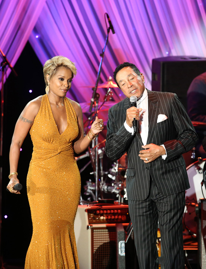 Mary J. Blige, left, and Smokey Robinson perform at the 2015 Clive Davis Pre-Grammy Gala show at the Beverly Hilton Hotel on Saturday, Feb. 7, 2015, in Beverly Hills, Calif. (Photo by Paul Hebert/Invision/AP)