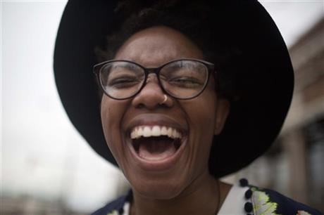 Tori Sisson laughs with excitement and wedding day jitters just before marrying Shante Wolfe, Monday, Feb. 9, 2015, in Montgomery, Ala. Alabama is the 37th state to allow same-sex marriage. (AP Photo/Brynn Anderson)