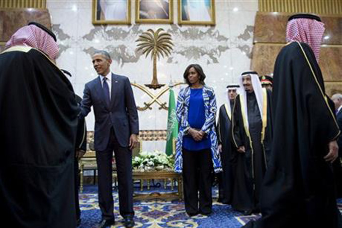 President Barack Obama and first lady Michelle Obama participate in a delegation receiving line with the new Saudi Arabian King, Salman bin Abdul Aziz, in Riyadh, Saudi Arabia, Tuesday, Jan. 27, 2015. The president and first lady have come to express their condolences on the death of the late Saudi Arabian King Abdullah bin Abdulaziz al-Saud. (AP Photo/Carolyn Kaster)