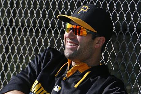 Pittsburgh Pirates second baseman Neil Walker waits for the beginning of an informal spring training baseball workout in Bradenton, Fla., Monday, Feb. 16, 2015. The first official practice for Pirates pitchers and catchers is Thursday, Feb. 19. (AP Photo/Gene J. Puskar)