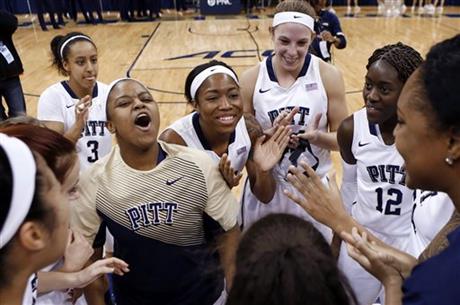 FILE - In this file photo from Jan. 8, 2015, Pittsburgh's Brianna Kiesel (3) and Monica Wignot, upper right, celebrate after upsetting North Carolina in an NCAA college basketball game in Pittsburgh. Two years removed from a 36-game conference losing streak, the Panthers are in the mix for an NCAA tournament berth behind Kiesel, a star point guard, forward Monica Wignot, who spent the last four years playing volleyball, and their energetic coach, Olympic gold medalist Suzie McConnell-Serio. (AP Photo/Keith Srakocic, File)
