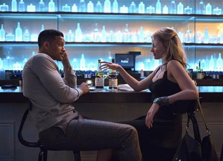 In this image released by Warner Bros. Pictures, Will Smith and Margot Robbie, right, appear in a scene from Focus. (AP Photo/Warner Bros. Pictures)